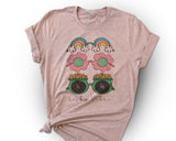 "Lucky Vibes Gold Rainbow" design on a peach unisex t-shirt