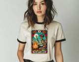"The Happy Camper Tarot" design on a natural ringer t-shirt with black contrast trim