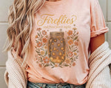 "Fireflies And Front Porch Nights" design on a peach unisex t-shirt