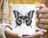 "Skull Butterfly Gothic" design on a white ceramic coffee mug