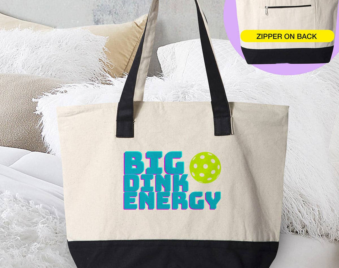 "Big Dink Energy" design on a natural canvas zippered tote bag