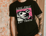 "Live Fast Eat Trash Raccoon" design on a unisex t-shirt