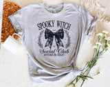 "Spooky Witch Social Club" design on a heather gray unisex t-shirt