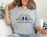 "I Stand With Ukraine Folk Flowers" design on a heather gray unisex t-shirt