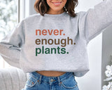"Never Enough Plants" design on an ash gray unisex crewneck sweatshirt