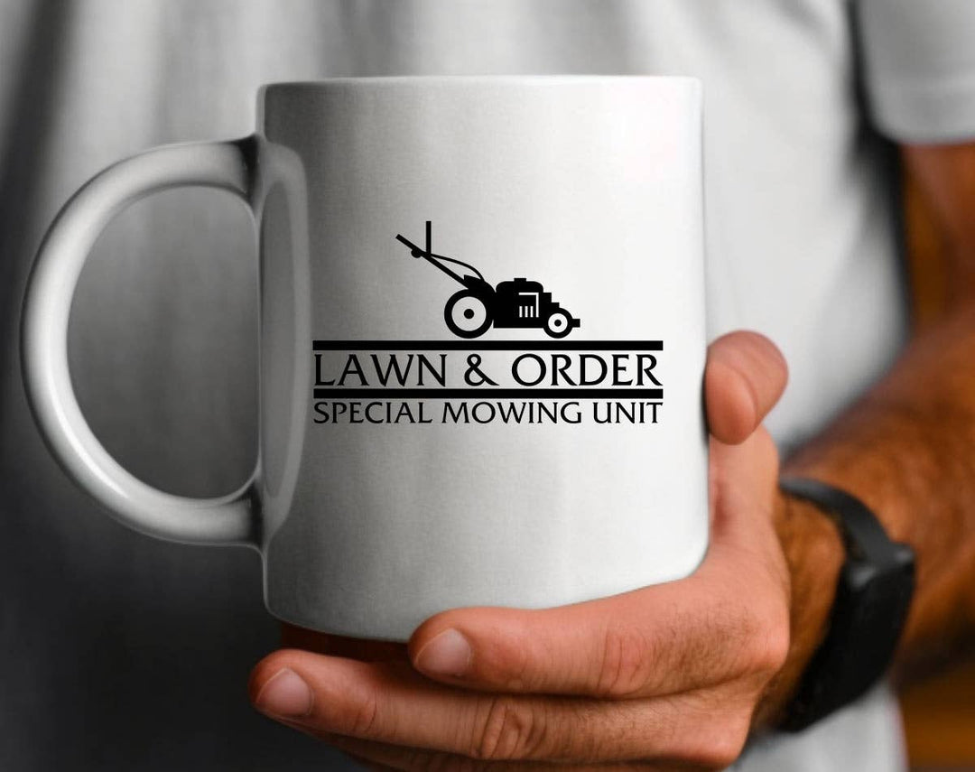 "Lawn & Order Special Mowing Unit" design on a white ceramic coffee mug