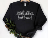 "Booktrovert" design, alternate view, on an ash gray unisex crewneck sweatshirt