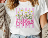 "Oopsie Daisy Striped" design on a white unisex t-shirt