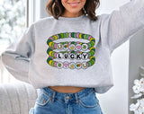 "Lucky Friendship Bracelet" design on an ash gray unisex crewneck sweatshirt