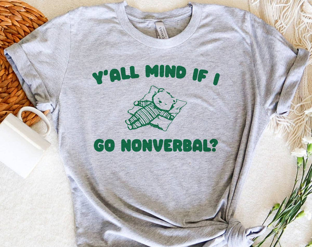 "Y'all Mind If I Go Nonverbal" design on a peach unisex t-shirt