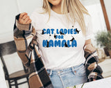 "Cat Ladies For Kamala" design on a white unisex t-shirt