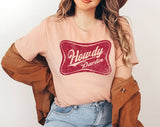 "Howdy Darlin'" design on a peach unisex t-shirt