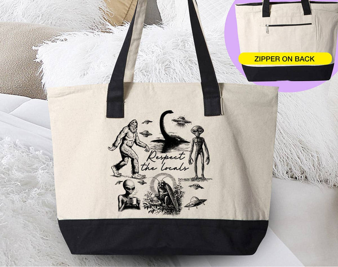 "Respect The Locals Mothman Bigfoot Ufo Alien" design on a natural canvas zippered tote bag