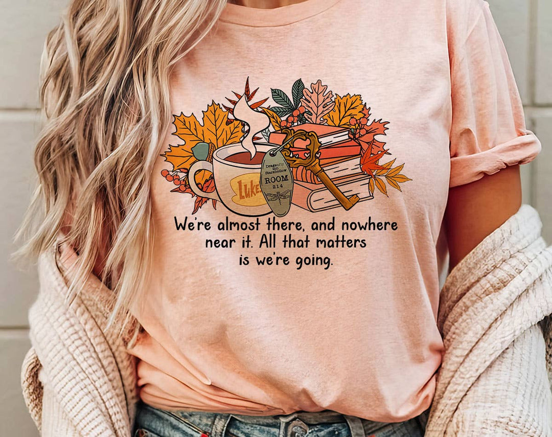 "We're Almost There Gilmore Girls" design on a peach unisex t-shirt