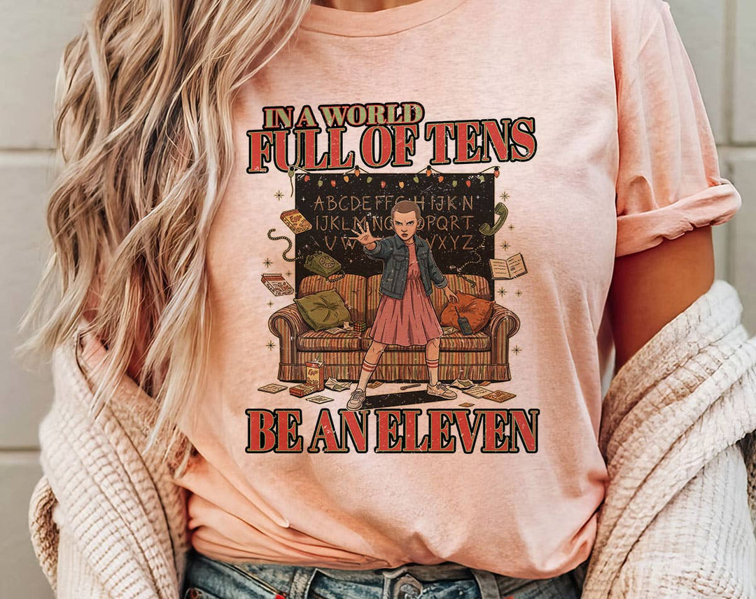 "Stranger Things In A World Full Of Tens" design on a peach unisex t-shirt