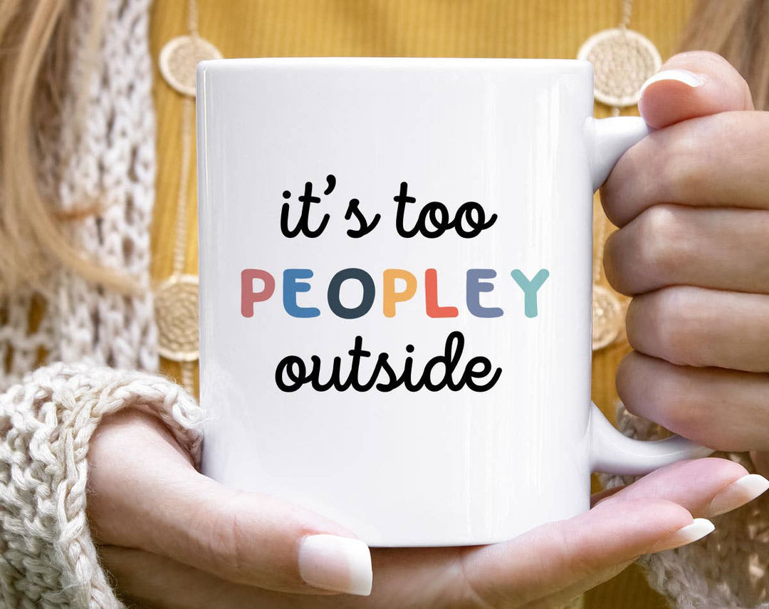 "It's Too Peopley Outside" design on a white ceramic coffee mug
