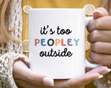 "It's Too Peopley Outside" design on a white ceramic coffee mug