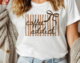"Coffee Addict Striped Bow" design on a white unisex t-shirt