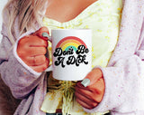 "Don't Be A Dick" design on a white ceramic coffee mug