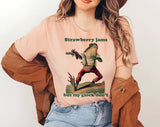 "Strawberry Jams, Glock Don't Frog Meme" design on a peach unisex t-shirt