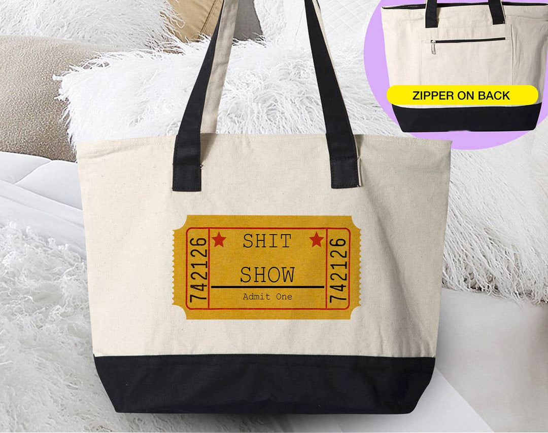 "One Ticket To The Sh*t Show" design on a natural canvas zippered tote bag