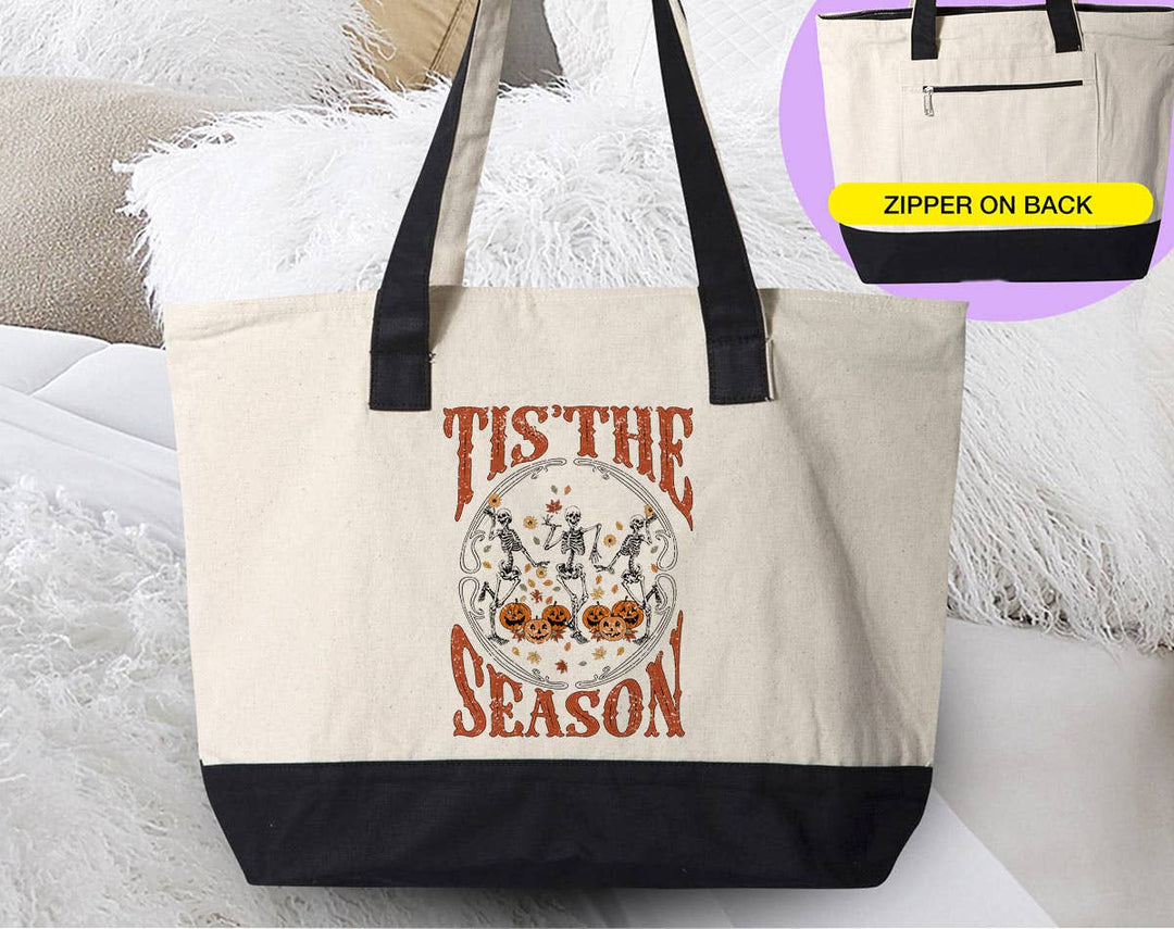"Tis The Season Skeletons" design on a natural canvas zippered tote bag