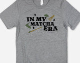 "In My Matcha Era" design on a heather gray unisex t-shirt