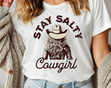 "Stay Salty Cowgirl" design on a white unisex t-shirt