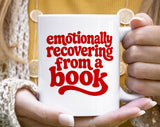 "Emotionally Recovering From A Book" design on a white ceramic coffee mug