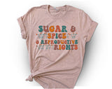 "Sugar And Spice And Reproductive Rights" design on a peach unisex t-shirt