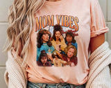 "Mom Vibes Peg & Roseanne" design on a peach unisex t-shirt