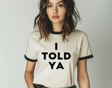 "I Told You" design on a natural ringer t-shirt with black contrast trim