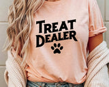 "Treat Dealer Dog" design on a peach unisex t-shirt