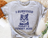 "I Survived Today's Tummy Ache" design on a heather gray unisex t-shirt