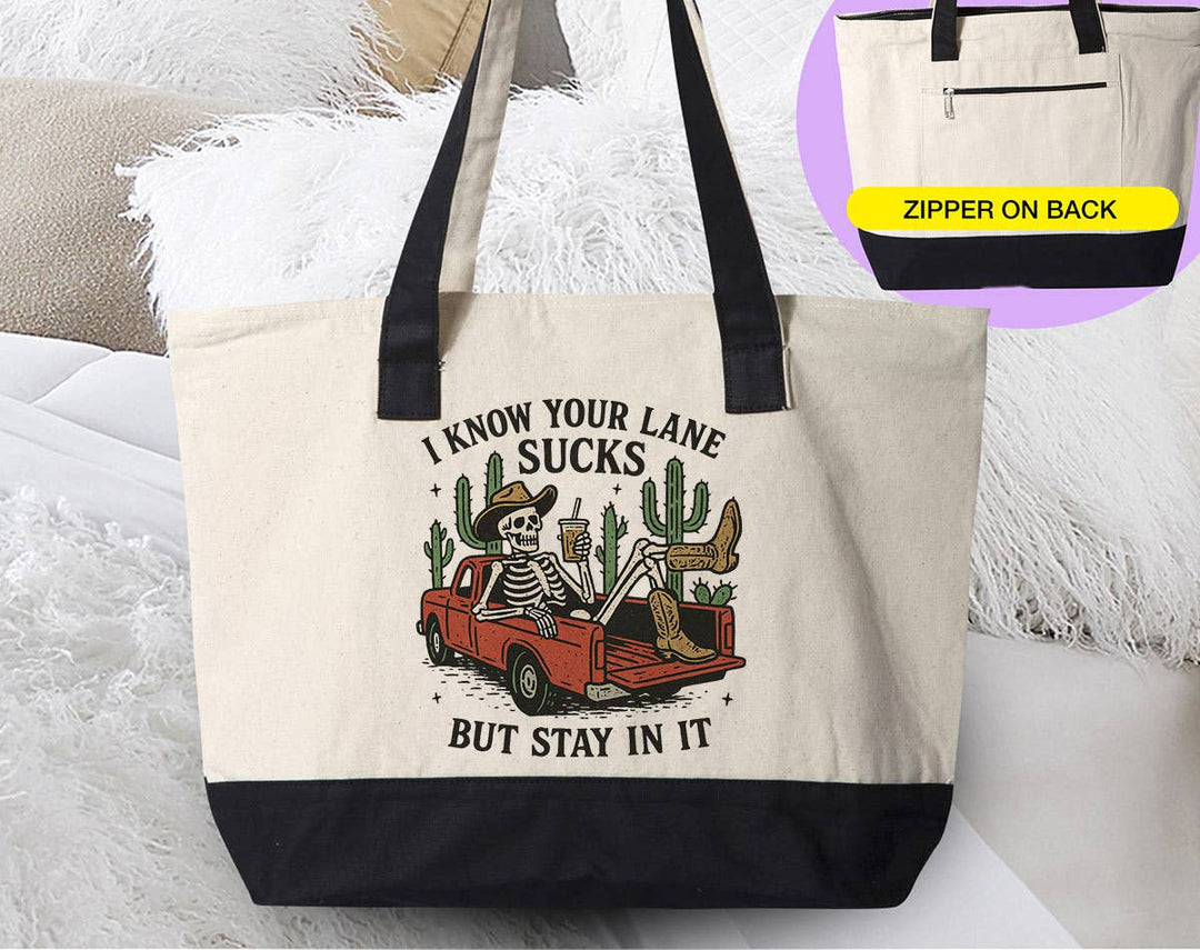 "I Know Your Lane Sucks Funny Sarcastic Skeleton" design on a natural canvas zippered tote bag