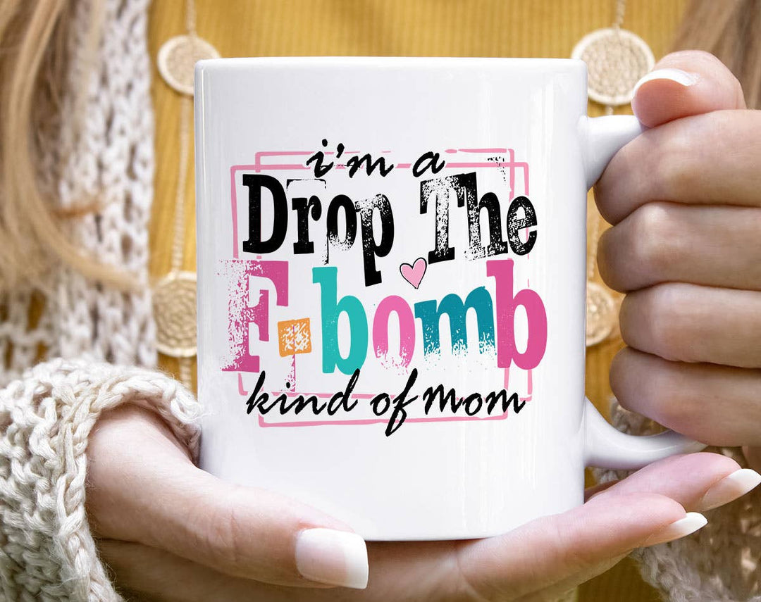 "I'm A Drop The F-Word Kind Of Mom" design on a white ceramic coffee mug