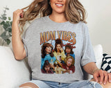"Mom Vibes Peg & Roseanne" design on a heather gray unisex t-shirt