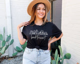 "Booktrovert Bookshelf" design on a black unisex t-shirt