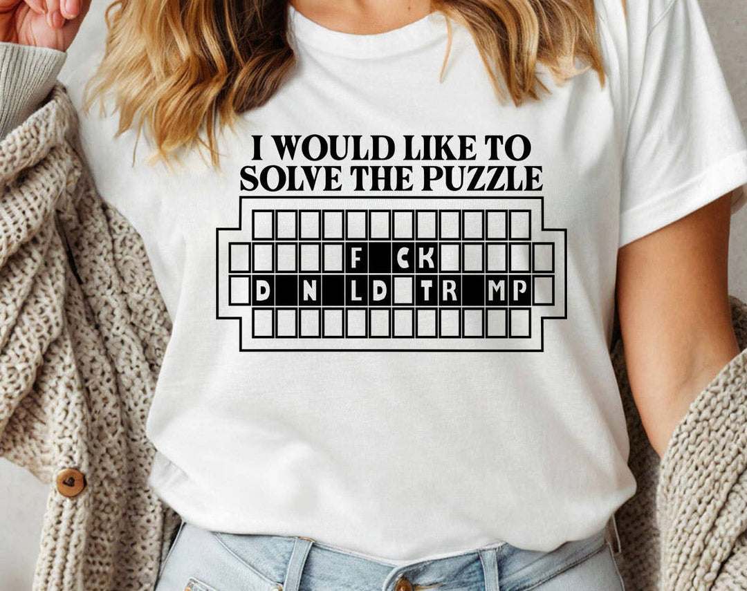 "Solve The Puzzle F*ck Trump" design on a white unisex t-shirt