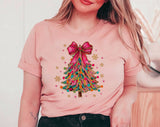 "Coquette Christmas Tree Pink Bow" design on a peach unisex t-shirt