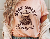 "Stay Salty Cowgirl" design on a peach unisex t-shirt