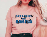 "Cat Ladies For Kamala" design on a peach unisex t-shirt