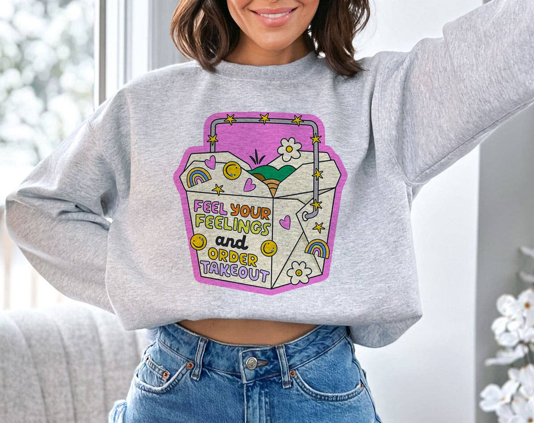 "Feel Your Feelings And Order Takeout" design on an ash gray unisex crewneck sweatshirt