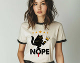 "Nope No Kings Black Cat" design on a natural ringer t-shirt with black contrast trim