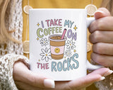 "I Take My Coffee On The Rocks" design on a white ceramic coffee mug