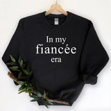 "In My Fiancée Era" design, alternate view, on a black unisex crewneck sweatshirt