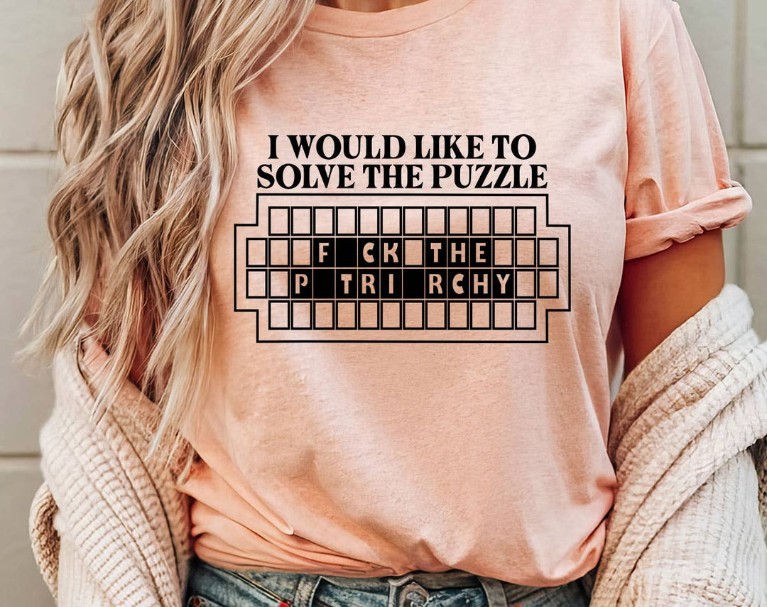 "Solve The Puzzle F*ck The Patriarchy" design on a peach unisex t-shirt