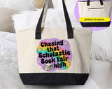 "Chasing That Scholastic Book Fair High" design on a natural canvas zippered tote bag