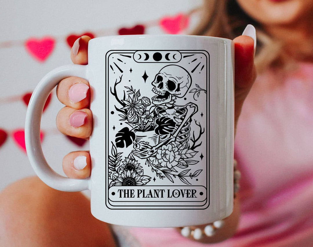 "The Plant Lover Tarot Black & White" design on a white ceramic coffee mug