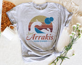 "Surf Arrakis" design on a heather gray unisex t-shirt